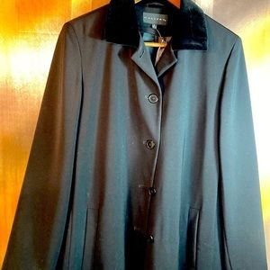 Classic long black size 14 winter coat with velvet collar.‎ 46” chest. 301